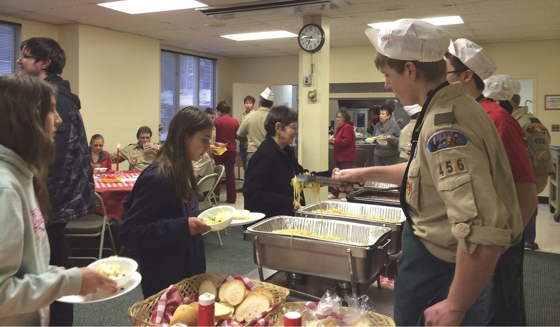 Boy Scouts and Confirmation candidates serve at the Spirit Weekend spaghetti dinner.